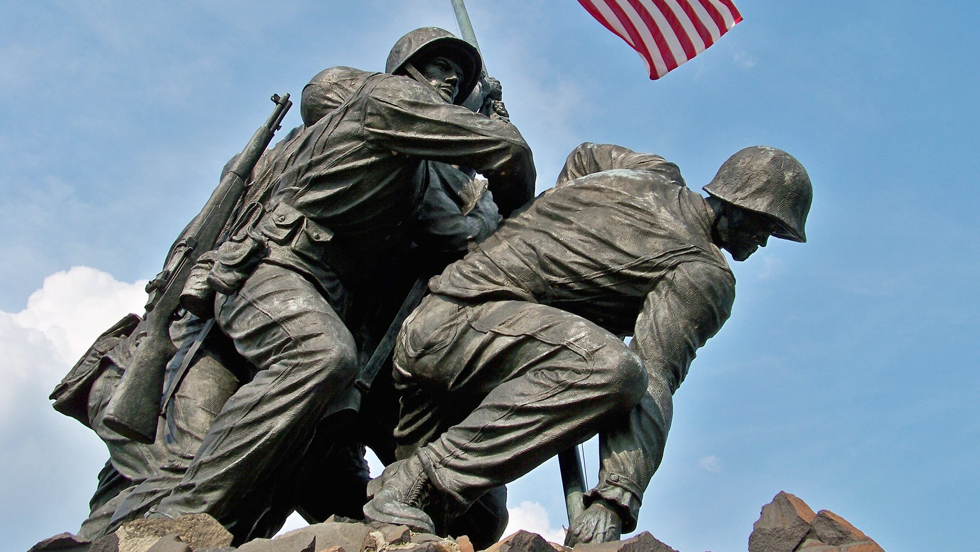 The Marine Corps War Memorial sits on the northern tip of Arlington National Cemetery, and features several men who didn't participate in the iconic flag-raising. Wikimedia Commons photo.