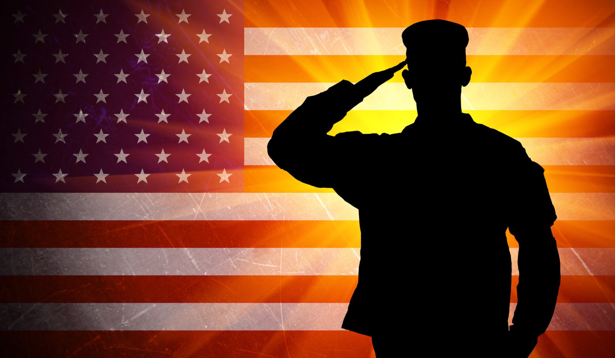 Proud saluting male army soldier on grungy american flag background