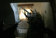 Marines from 1st Battalion, 3rd Marines, search houses during the second battle of Fallujah on Nov. 13, 2004. Photo courtesy of Garrett Anderson.