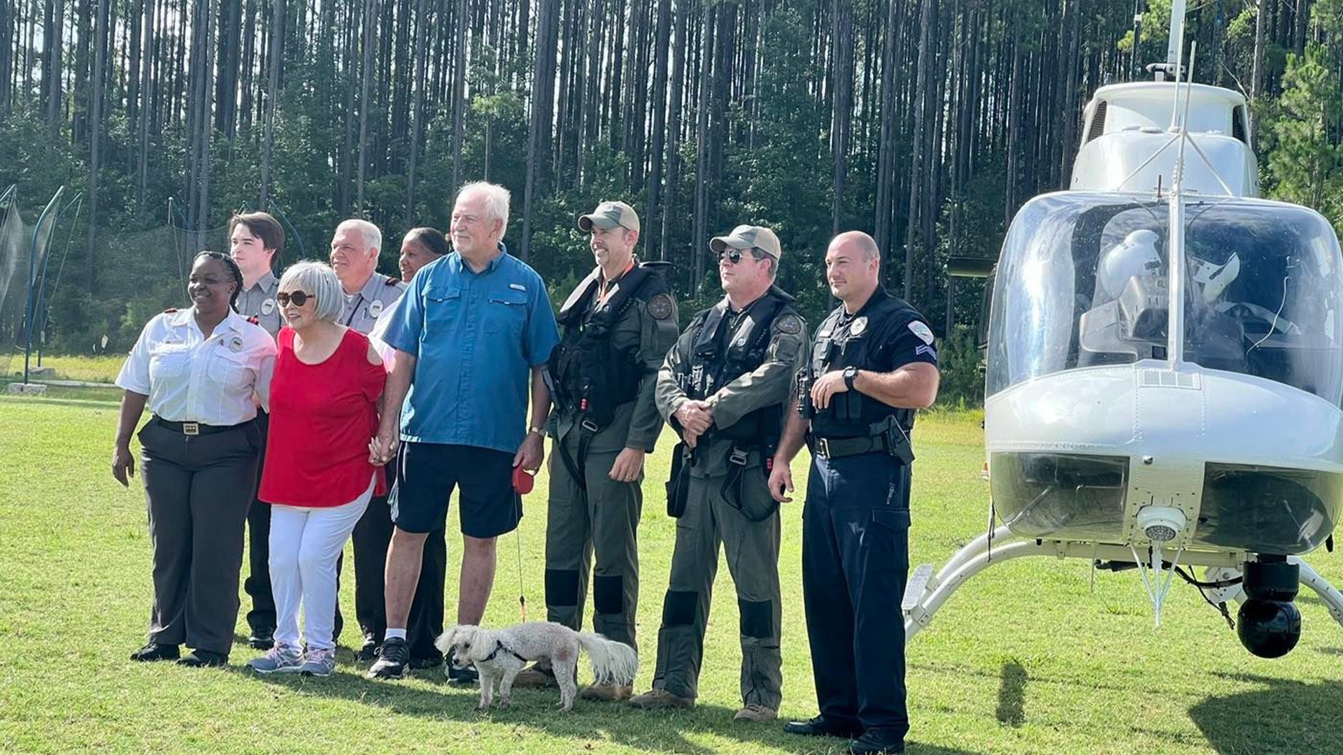 Sun City resident Raymond Teague (center, with dog Beauregard) reunited with the men and women who came to his rescue on the afternoon of June 18, 2022, in Beaufort County, South Carolina. Beaufort County Sheriff's Office photo.