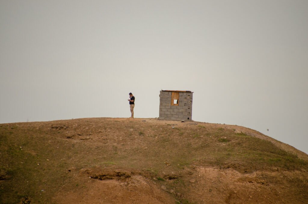 An Iraqi spotted on a cell phone by the U.S. Marines on patrol. Photo by Kevin Knodell/Coffee or Die.