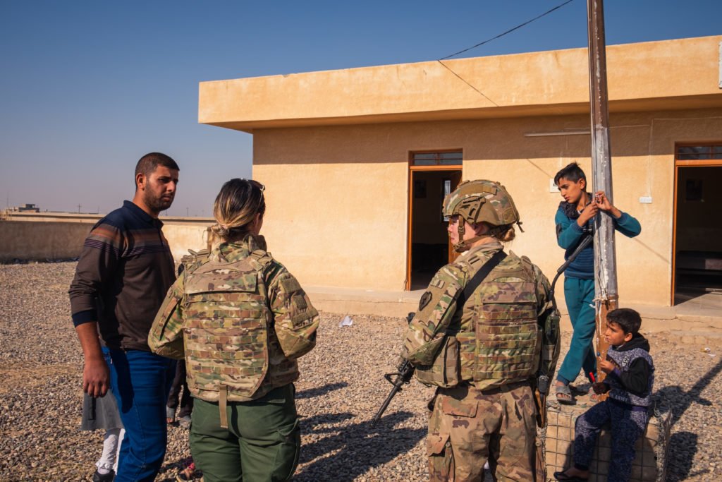 1st Lt. LaNeve and Dalia talk with the Sheikh’s brother. 