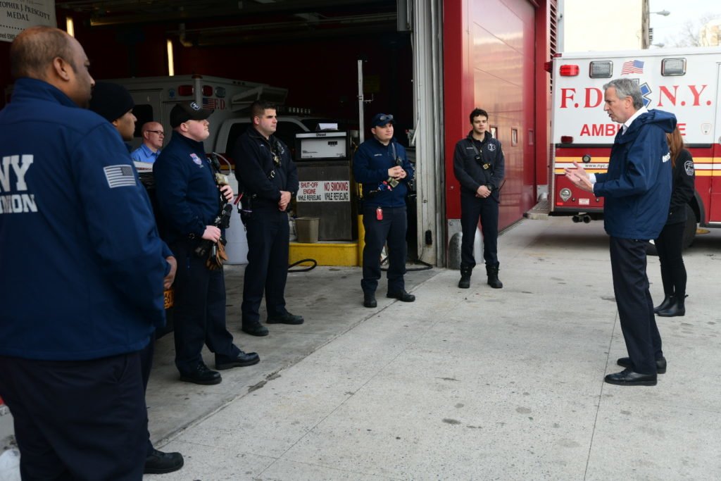 On April 2, Mayor Bill de Blasio visited FDNY EMTs and Paramedics at Station 50 in Queens to thank them for their extraordinary work throughout the COVID-19 pandemic. EMS members have been responding to a 50 percent increase in medical calls each day. Photo courtesy of the New York City Fire Department Facebook page.