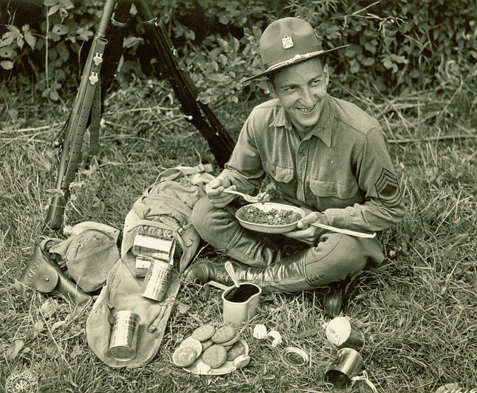 A soldier samples a batch of C-Rations during the Louisiana Maneuvers in the fall of 1941, just prior to America’s entry into World War II. Photo courtesy of the U.S. Army.