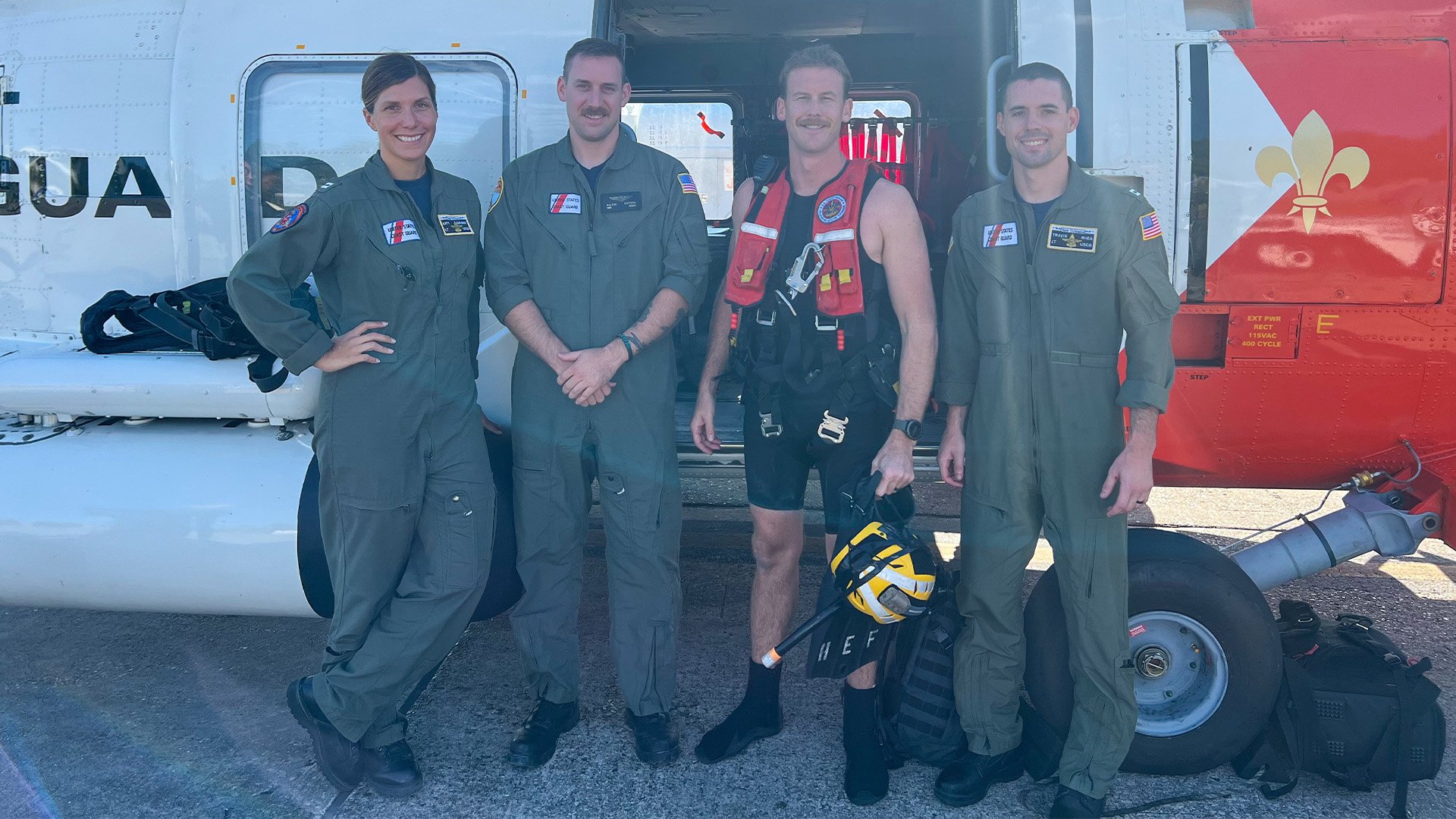 From left: US Coast Guard Lt. Katy Caraway, Aviation Maintenance Technician 2nd Class Dalton Goetsch, rescue swimmer Aviation Survival Technician 2nd Class Richard “Dicky” Hoefle, and Lt. Travis Rhea, an Air Station New Orleans MH-60T Jayhawk aircrew credited with rescuing three missing boaters off Louisiana on Oct. 9, 2022. US Coast Guard photo.