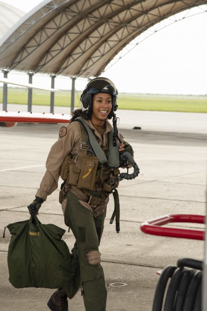 Student Naval Aviator Lt. j.g. Madeline Swegle, assigned to the Redhawks of Training Squadron (VT) 21 at Naval Air Station Kingsville, Texas, exits a T-45C Goshawk training aircraft following her final flight to complete the undergraduate Tactical Air (Strike) pilot training syllabus, July 7, 2020. Swegle is the U.S. Navy's first known Black female strike aviator and will receive her Wings of Gold during a ceremony July 31. Photo by Anne Owens/U.S. Navy, Released.