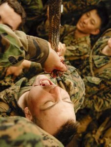 A US Marine drinks cobra blood in a Thai warrior ritual during Exercise Cobra Gold.