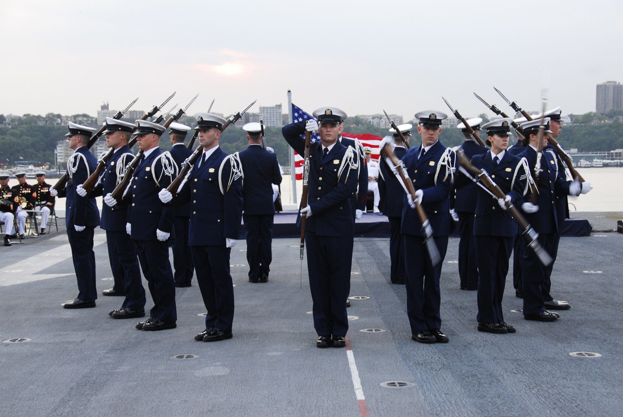 Coast Guard Ceremonial Honor Guard Silent Drill Team performs during the sunset parade aboard the USS Wasp Sunday, May 27, 2012 during Fleet Week New York. Fleet Week is the city's celebration of the sea services held nearly every year since 1984. U.S. Coast Guard photo by Petty Officer 2nd Class Ayla Kelley.