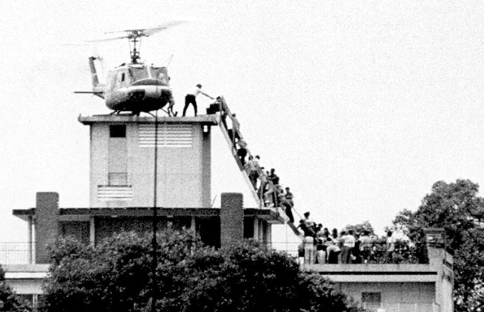 On August 29, 1975, Dutch photojournalist Hubert Van Es captured the historic photograph showing a helicopter evacuating people from a rooftop during the Fall of Saigon. Initial reports misidentified the rooftop as the US Embassy.