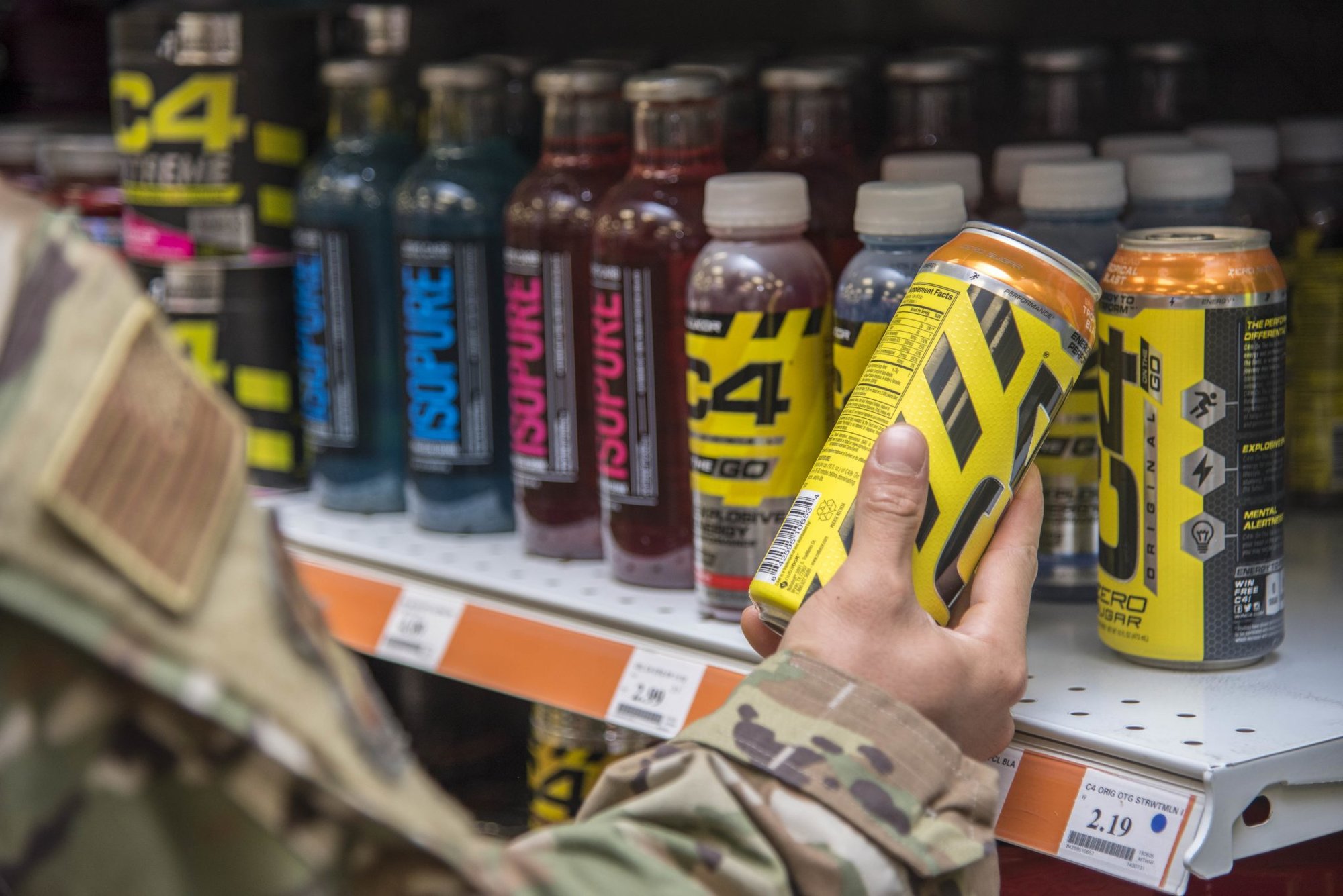 An Airman from Dover Air Force Base, Del., checks the label on a supplement, January 15, 2020. Service members should remain diligent and check labels on consumer products and follow official guidance on CBD products. (U.S. Air Force photo by Staff Sgt. Nicole Leidholm)