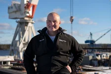 Charles F. Krugh, president of Bath Iron Works, poses at the shipyard Tuesday, Dec. 20, 2022, in Bath, Maine. The former Gulfstream Areospace executive and US Army veteran oversees a workforce that builds destroyers for the Navy. Associated Press photo by Robert F. Bukaty.