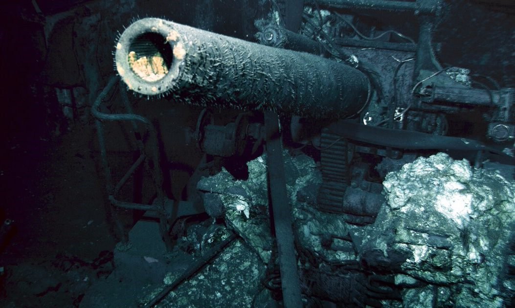 One of the unmistakable 5-inch guns protruding from the wreckage of the Indianapolis. When the ship was found in 2017, the ship’s bell and anchor were also positively identified. Photo by Paul G. Allen, courtesy of Navigea Ltd R/V Petrel.