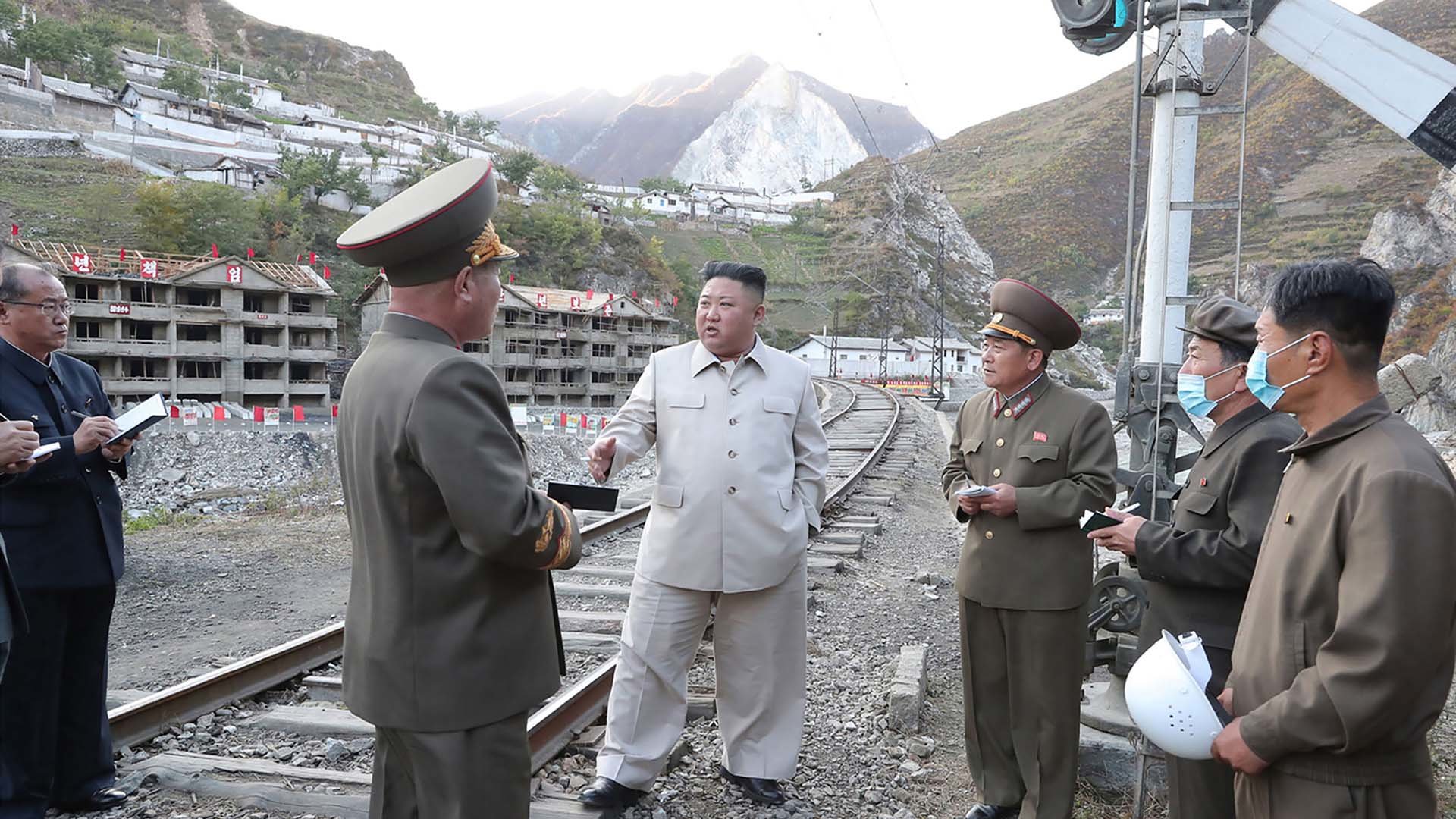 This undated picture released from North Korea's official Korean Central News Agency in 2020 shows North Korean leader Kim Jong Un (center) inspecting the rehabilitation site in the Komdok area of South Hamgyong Province. Korean Central News Agency photo via Getty Images.
