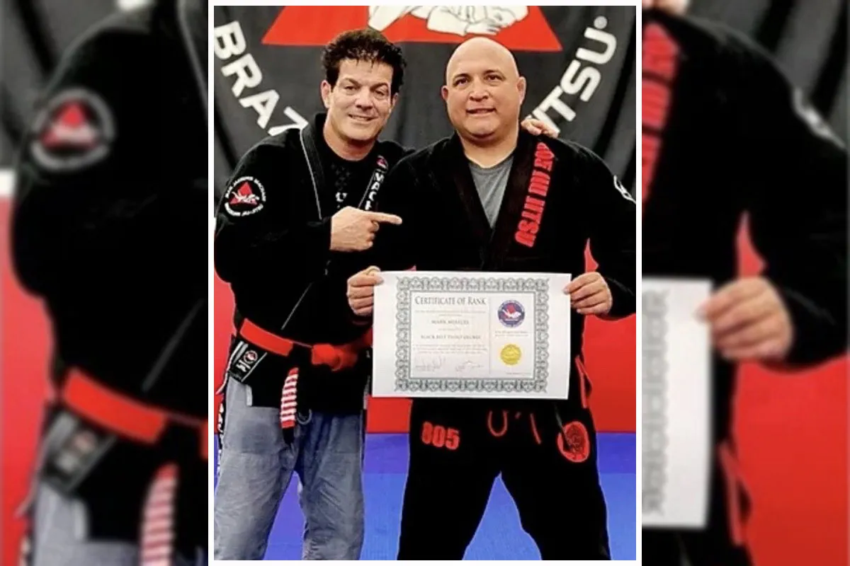 Mireles receiving his 3rd degree black belt in BJJ from the legendary Jean Jac Machado. Photo courtesy of Mark Mireles.