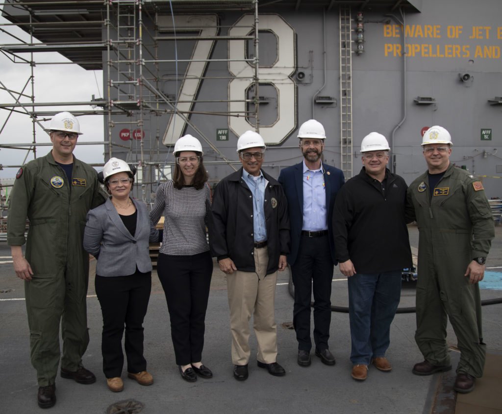 Rep. Bobby Scott, Rep. Rob Wittman, Rep. Elaine Luria, and Rep. Denver Riggleman, U.S. Representatives of Congress from Virginia, pose for a group photo with Capt. John J. Cummings, USS Gerald R. Ford's (CVN 78) commanding officer, left, and Capt. Tim Waits, Ford's executive officer, right, on March 15, 2019. Rep. Scott and other members of congress from Virginia were aboard to receive a first-hand account of the ship's post-shakedown availability at Huntington Ingalls Industries-Newport News Shipbuilding. U.S. Navy photo by Mass Communication Specialist Seaman Marissa Bacon.