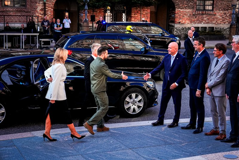 Ukraine's President Volodymyr Zelenskyy and Ukraine's First Lady Olena Zelenska, left, are welcomed by speaker of the Danish Parliament, Soeren Gade.