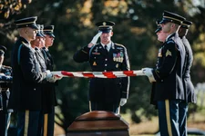 The US Army Honor Guard, the 3rd US Infantry Regiment (The Old Guard) Caisson Platoon, and the US Army Band, “Pershing’s Own,” conduct the funeral of US Army Staff Sgt. Bryan Black in Section 60 of Arlington National Cemetery, Arlington, Virginia, Oct. 30, 2017. Black, a native of Puyallup, Washington, was assigned to Company A, 2nd Battalion, 3rd Special Forces Group (Airborne) on Fort Bragg, North Carolina, when he died from wounds sustained during enemy contact in the country of Niger in West Africa, Oct. 4, 2017. Even in the absence of an active war, service members continue to die from another byproduct of the GWOT — cancer. US Army photo by Elizabeth Fraser/Arlington National Cemetery.