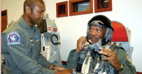 COLUMBUS AIR FORCE BASE, Miss. — Master Sgt. Curtis Chiles (left) conducts egress training for actor Morgan Freeman before his orientation flight in a T-37 Tweet here Aug. 12.  Mr. Freeman, who starred in the 2002 movie “Sum of All Fears,” also ate lunch with about 50 Airmen from the base and visited the radar approach control facility and the air traffic control tower.  Sergeant Chiles is assigned to the 14th Medical Operations Squadron.  (U.S. Air Force photo by 1st Lt. Jennifer Moore)