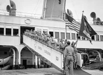 Some 1,000 members of the Women’s Ambulance and Defense Corps of America staged extensive mimic maneuvers at Santa Catalina Island, in a demonstration of technique and training acquired since their organization was formed. One of 27 units disembarking after arrival at Avalon, California, July 28, 1941, by steamer. The corps is composed of women volunteers who devote two nights each week to military drills and schooling. AP photo by Ed Widdis.