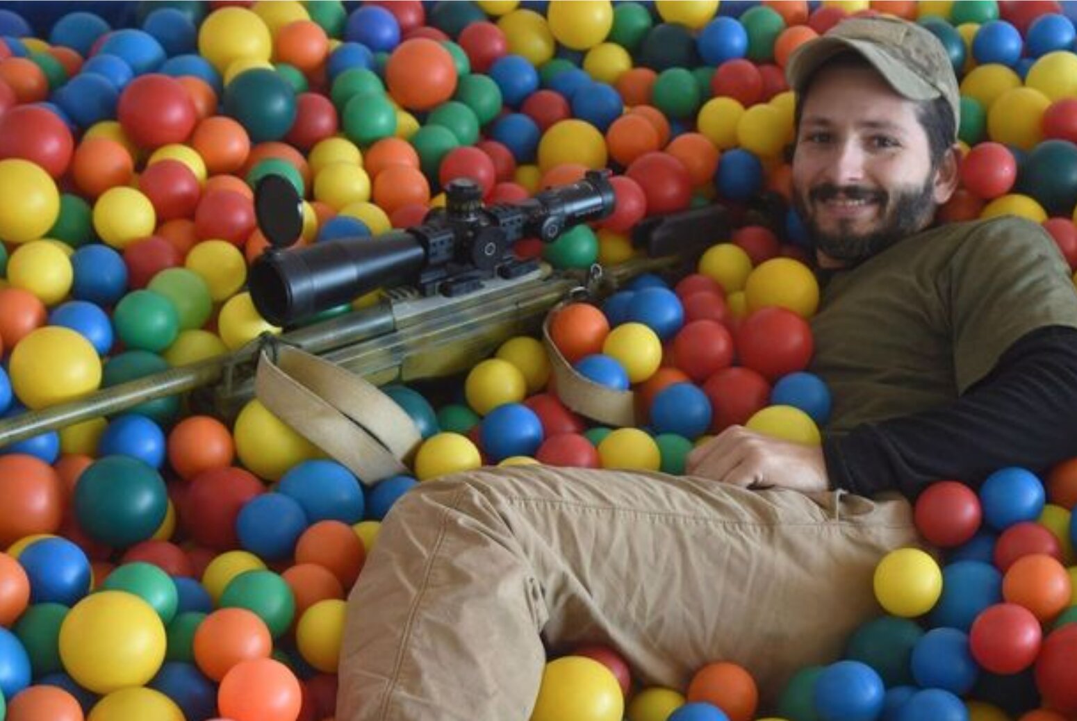 Canadian sniper ‘Wali’ expertly conceals himself in a ball pit. Photo courtesy of We Are The Mighty.