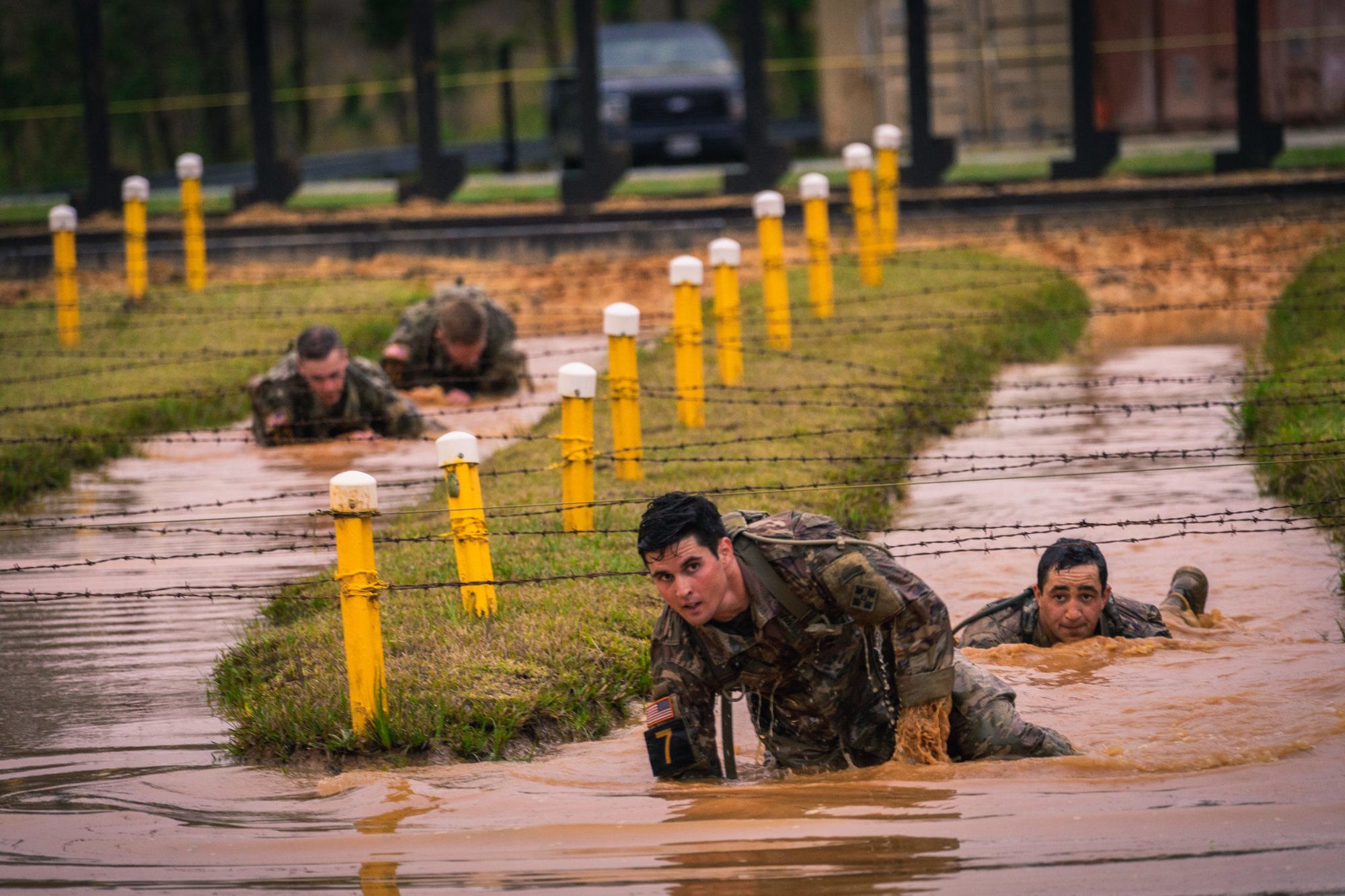 Best Ranger competitors negotiate a water obstacle on the Malvesti obstacle course at Camp Rogers. Photo by Marty Skovlund, Jr./Coffee or Die.