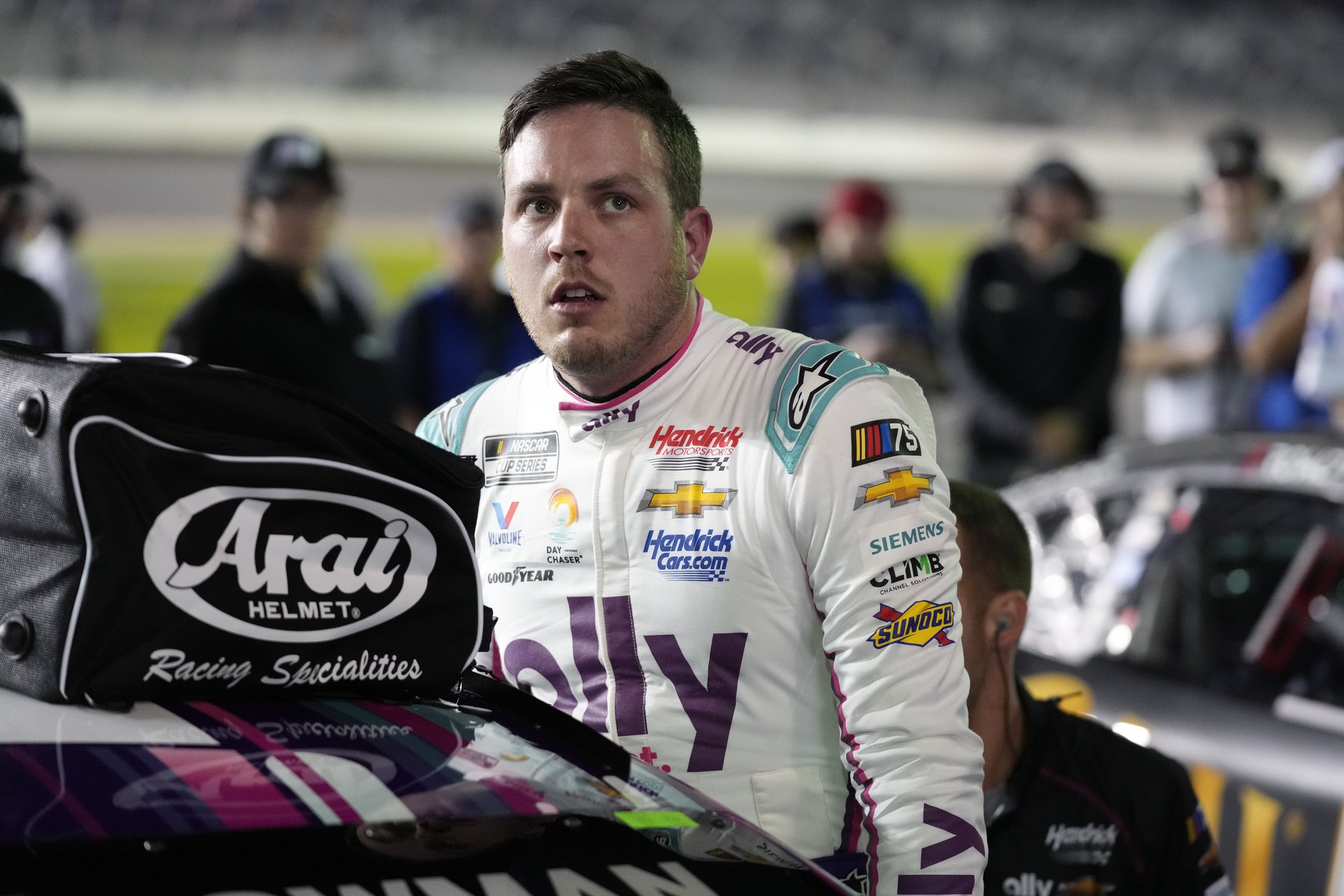 Alex Bowman climbs out of his car after qualifying for the NASCAR Daytona 500 auto race at Daytona International Speedway, Wednesday, Feb. 15, 2023, in Daytona Beach, Fla. (AP Photo/John Raoux)