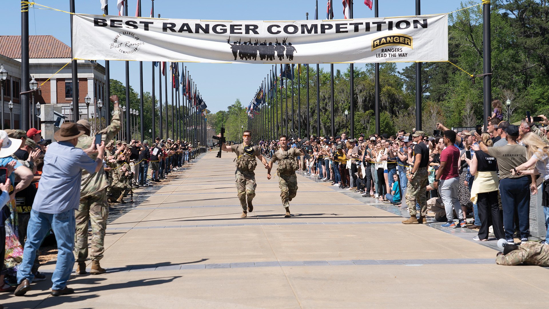 Tymothy Boyle and Joshua Corson, both captains in the 75th Ranger Regiment, cross the finish line of the final event. The pair beat 50 other teams from across the Army to win the annual three-day competition. Photo by Noelle Wiehe/Coffee or Die Magazine.