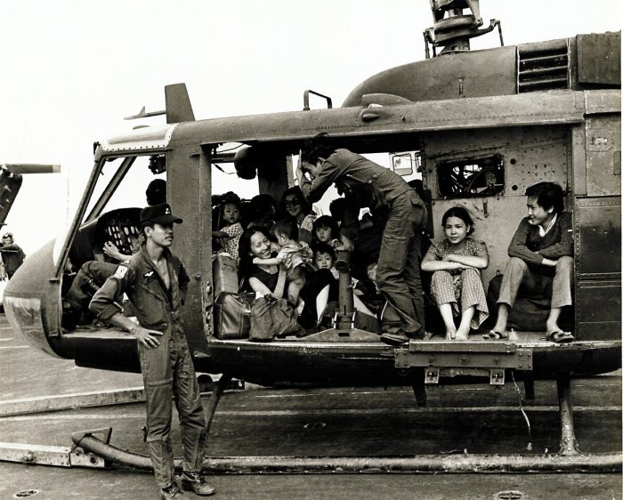 A VNAF UH-1H Huey loaded with Vietnamese evacuees on the deck of the U.S. aircraft carrier USS Midway (CV-41) during Operation Frequent Wind, 29 April 1975. Photo courtesy of the U.S. Navy.