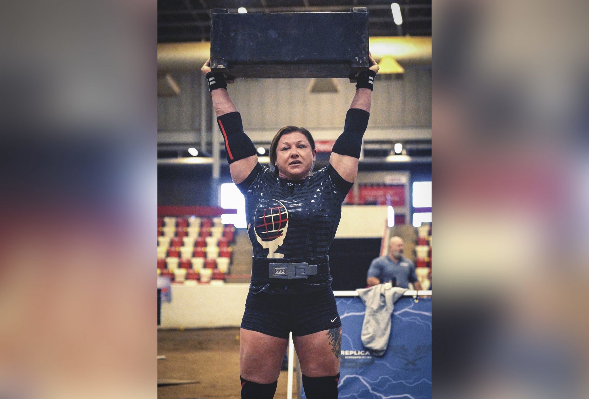 Staff Sgt. Gabriele Burgholzer successfully lifts 194 pounds over her head, setting a new world record in the women’s middleweight division during the Mouser Block event at the Mammoth Strength Challenge on Jan.23 in Bowling Green, Kentucky. Photo by Sgt. Nicole Narciso.