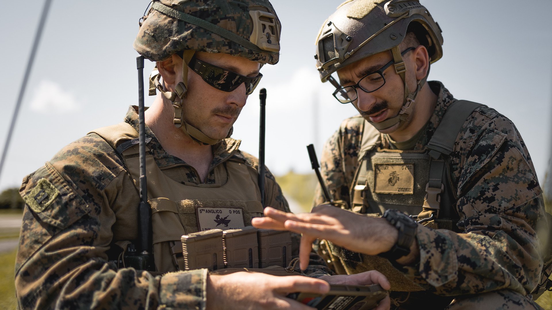 US Marine Corps Capt. Christian Link, a forward air controller/air officer, and Sgt. Zachary Verrier, a transmissions systems operator assigned to 5th Air Naval Gunfire Liaison Company, III Marine Expeditionary Force Information Group, use an Android Tactical Assault Kit to coordinate targeting processes during exercise Katana Strike on Kumejima, Okinawa, Japan, Oct. 26, 2022. US Marine Corps photo by Staff Sgt. Manuel Serrano.