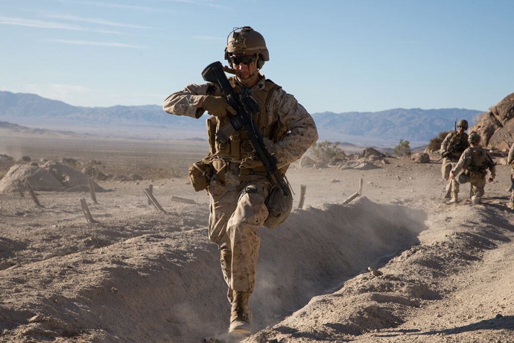 U.S. Marine Corps Sgt. Sean Nash provides cover fire during the Integrated Training Exercise (ITX) at Marine Air Ground Combat Center Twentynine Palms, California, Jan. 28, 2020. ITX is a month-long training event that prepares Marines for deployment. Photo by Cpl. Jack C. Howell/U.S. Marine Corps, Released.