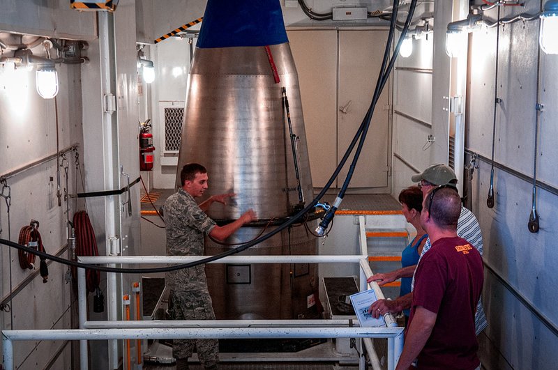 Senior Airman Nicholas Kolja, 90th Missile Operations Squadron, explains how the top stage of a Minuteman III missile is handled