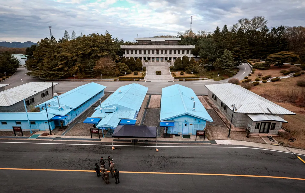  South Korean and U.S. Army soldiers, wearing gray uniforms, gather during a rehearsal to mark the first anniversary of a summit between South Korean President Moon Jae-in and North Korean leader Kim Jong Un.