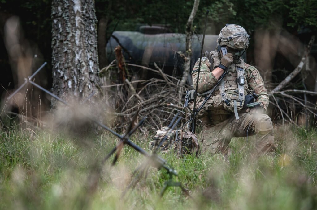 A soldier conducts a radio check with the tactical operations center during Exercise Saber Junction 2019 in Hohenfels Training Area, Germany, Sept. 22, 2019. Photo by Sgt. Henry Villarama/U.S. Army.