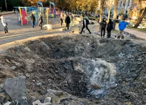 The crater left by a Russian missile strike in Kyiv's Shevchenko Park on Oct. 10, 2022. Photo by Nolan Peterson/Coffee or Die.