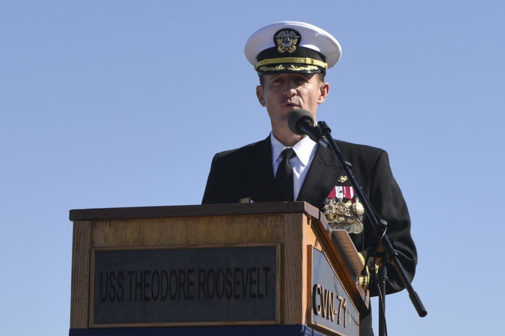 On Nov. 1, 2019, Capt. Brett Crozier addresses the crew for the first time as commanding officer of the aircraft carrier USS Theodore Roosevelt (CVN 71) during a change of command ceremony on the ship’s flight deck. Crozier relieved Capt. Carlos Sardiello to become the 16th commanding officer of Theodore Roosevelt. Crozier was recently relieved as commanding officer of the warship due to a leaked memo regarding the U.S. Navy's response to a COVID-19 outbreak on the ship. U.S. Navy photo by Mass Communication Specialist 3rd Class Sean Lynch/Released. Photo Courtesy of the Defense Visual Information Distribution Service.