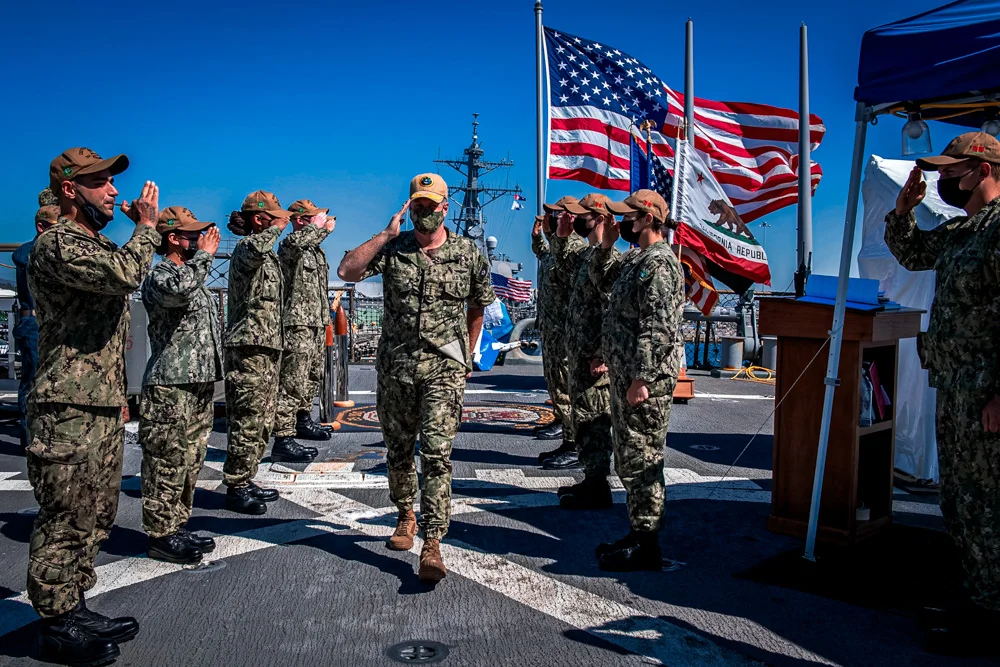 Adm. Samuel Paparo, Commander, U.S. Pacific Fleet, is piped aboard the Arleigh Burke-class guided-missile destroyer USS Fitzgerald (DDG 62) for a scheduled visit to the ship. During the visit, Paparo presented a relic from the USS Arizona (BB 39) to the crew of the Fitzgerald in remembrance and commemoration of the 80th anniversary of the attack on Pearl Harbor. 