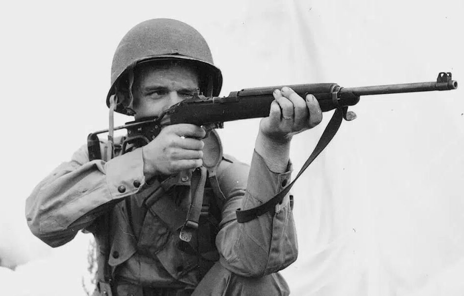 An American paratrooper takes aim with an M1 Carbine. Photo courtesy of Sandboxx.