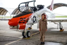 200707-N-N0436-1027
KINGSVILLE, Texas (July 7, 2020) Student Naval Aviator Lt. j.g. Madeline Swegle, assigned to the Redhawks of Training Squadron (VT) 21 at Naval Air Station Kingsville, Texas, stands by a T-45C Goshawk training aircraft following her final flight to complete the undergraduate Tactical Air (Strike) pilot training syllabus, July 7, 2020. Swegle is the Navy’s first known Black female strike aviator and will receive her Wings of Gold during a ceremony July 31. (U.S. Navy photo by Lt.j.g. Luke Redito/Released)