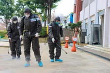 Two U.S. Army Soldiers and a Republic of Korea Army Soldier spray a COVID-19 infected area with a solution of disinfectant in Daegu, Republic of Korea, March 13, 2020. The Soldiers wear personal protective equipment with the primary function of protecting themselves from the disinfecting agent. (U.S. Army photo by Spc. Hayden Hallman, 20th Public Affairs Detachment)