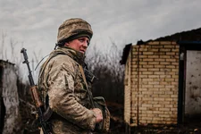 A Ukrainian serviceman stands at his position at the line of separation between Ukraine-held territory and rebel-held territory near Svitlodarsk, eastern Ukraine, Wednesday, Feb. 23, 2022. AP photo by Evgeniy Maloletka.