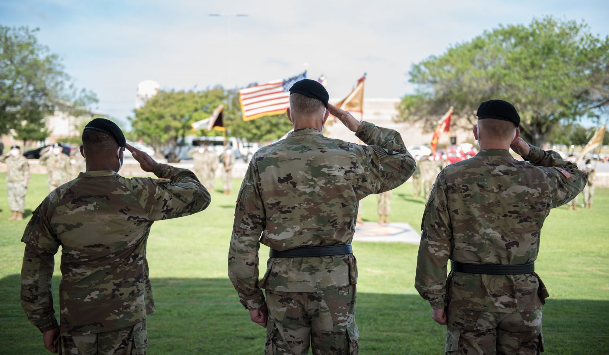(From left to right) 13th ESC Commanding General, Col. (P) Ronald R. Ragin, Maj. Gen. Scott Efflandt, Deputy Commanding General, III Corps and Fort Hood and outgoing Commanding General, Brig. Gen. Darren L. Werner, salute before passing the colors. (U.S. Army photo by Sgt. 1st Class Kelvin Ringold)