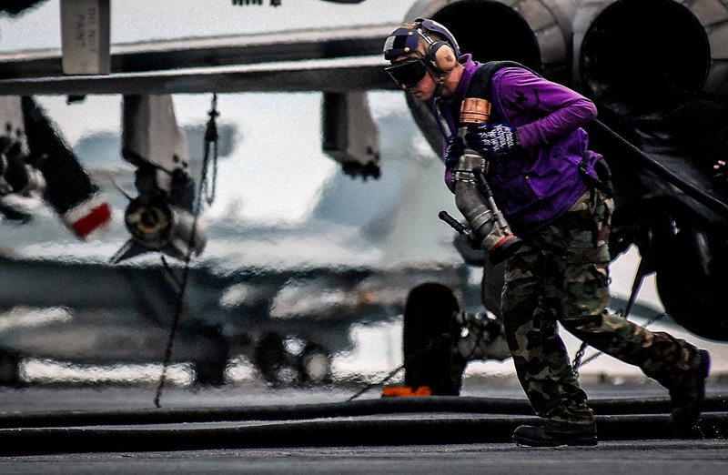 purple shirts aircraft carrier, aircrew colored shirts