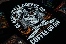 Josh Raulerson is a senior graphic artist at Black Rifle Coffee and is behind many of their iconic coffee bag and merch designs. Now, he's made an exclusive, limited edition BRCC Shirt Club release. Coffee or Die sat down with the artist to get the BTS on this awesome new Blackbeard-inspired (yes, the pirate) long-sleeve T-shirt.  