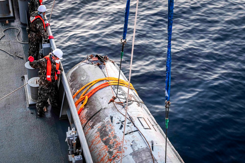 This photo provided by South Korea's Defense Ministry shows an object salvaged by South Korea's military that is presumed to be part of the North Korean space-launch vehicle that crashed into sea following a launch failure
