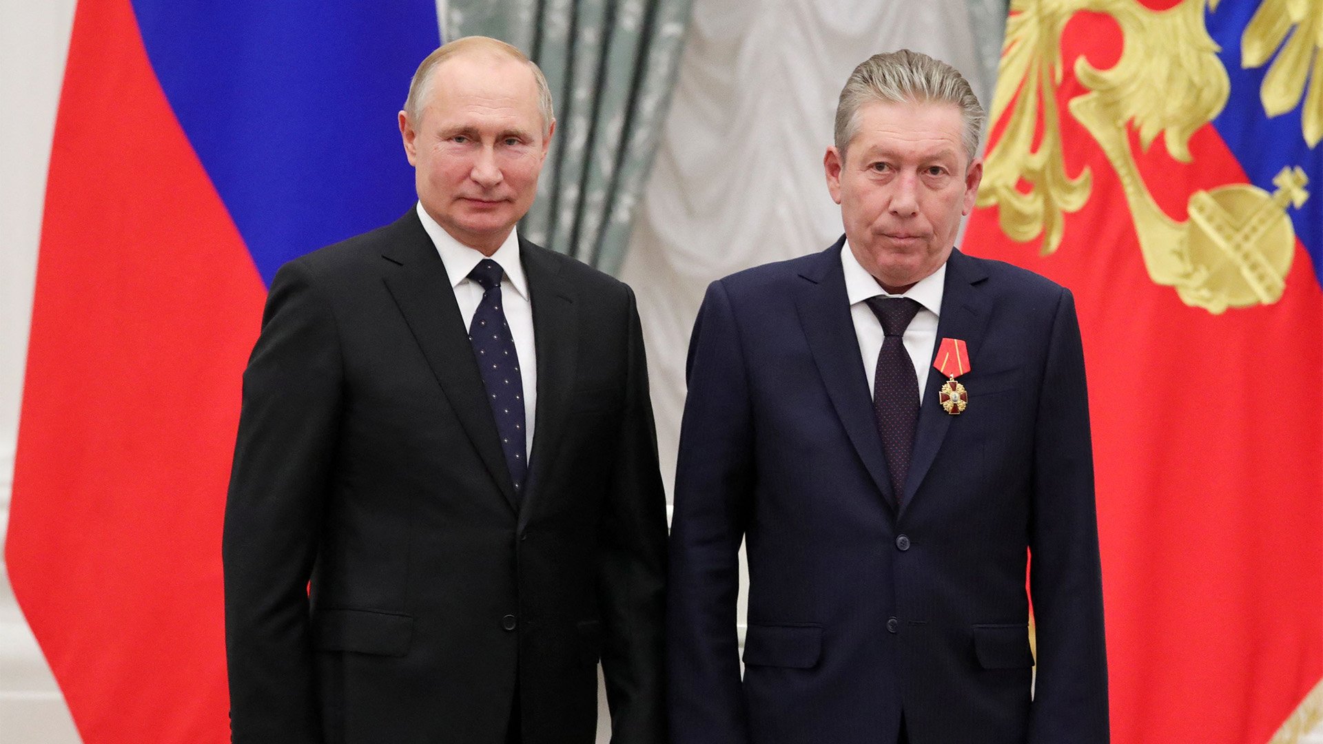 Russia's President Vladimir Putin, left, and Chairman of the Board of Directors of petroleum giant Lukoil, Ravil Maganov, pose for a photo during a Kremlin award ceremony on Nov. 21, 2019, less than three years before the CEO publicly criticized Putin's war in Ukraine. Photo by Mikhail Klimentyev/Sputnik/AFP via Getty Images.