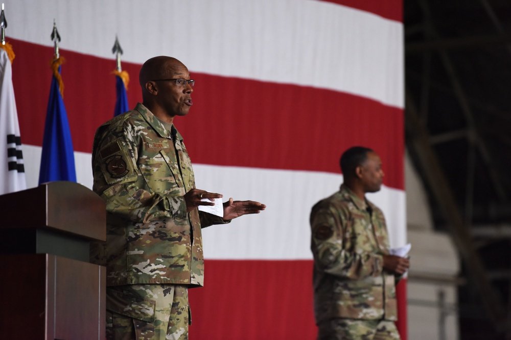 Gen. CQ Brown, Jr., Pacific Air Forces commander, and Chief Master Sgt. Anthony Johnson, PACAF command chief, brief the men and women of Team Osan during an all-call at Osan Air Base, Republic of Korea, Oct. 17, 2019. U.S. Air Force photo by Staff Sgt. Benjamin Bugenig.
