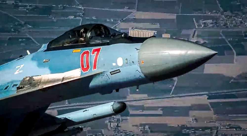 n this image from video released by the U.S. Air Force, a Russian fighter jet flies close to a U.S. drone over Syria, July 23, 2023. A Russian fighter jet flew within a few meters of a U.S. drone over Syria and fired flares at it, striking the American aircraft and damaging it.