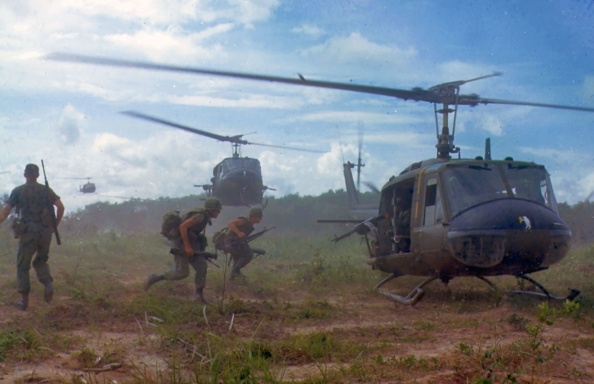 U.S. Army Bell UH-1D helicopters airlift members of the 2nd Battalion, 14th Infantry Regiment from the Filhol Rubber Plantation area to a new staging area, during Operation "Wahiawa," a search and destroy mission conducted by the 25th Infantry Division, northeast of Cu Chi, South Vietnam, 1966. Photo by SFC James K. F. Dung, courtesy of the National Archives and Records Administration.