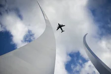 A C-17 flies over the Air Force Memorial in Arlington, Virginia. The US will begin airlifting Afghan contractors to Fort Lee soon, Pentagon officials said. US Air Force photo by Master Sgt. Michael B. Keller.